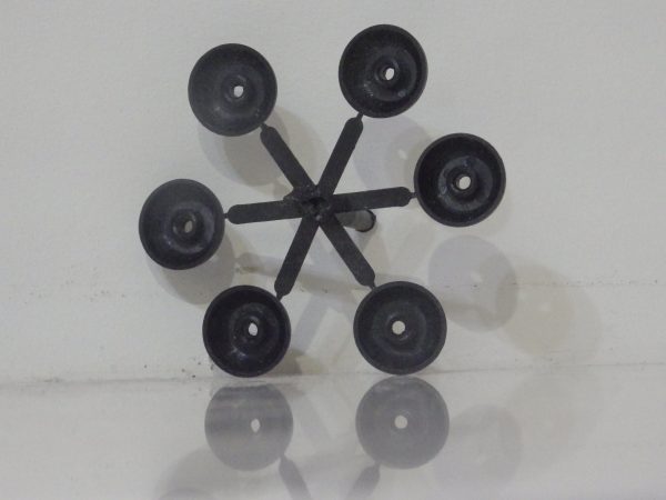 Black polypropylene Screw Protector to suit 8mm Dia. Cap Head Bolts with 6mm Hex Head shown attached on moulding sprue